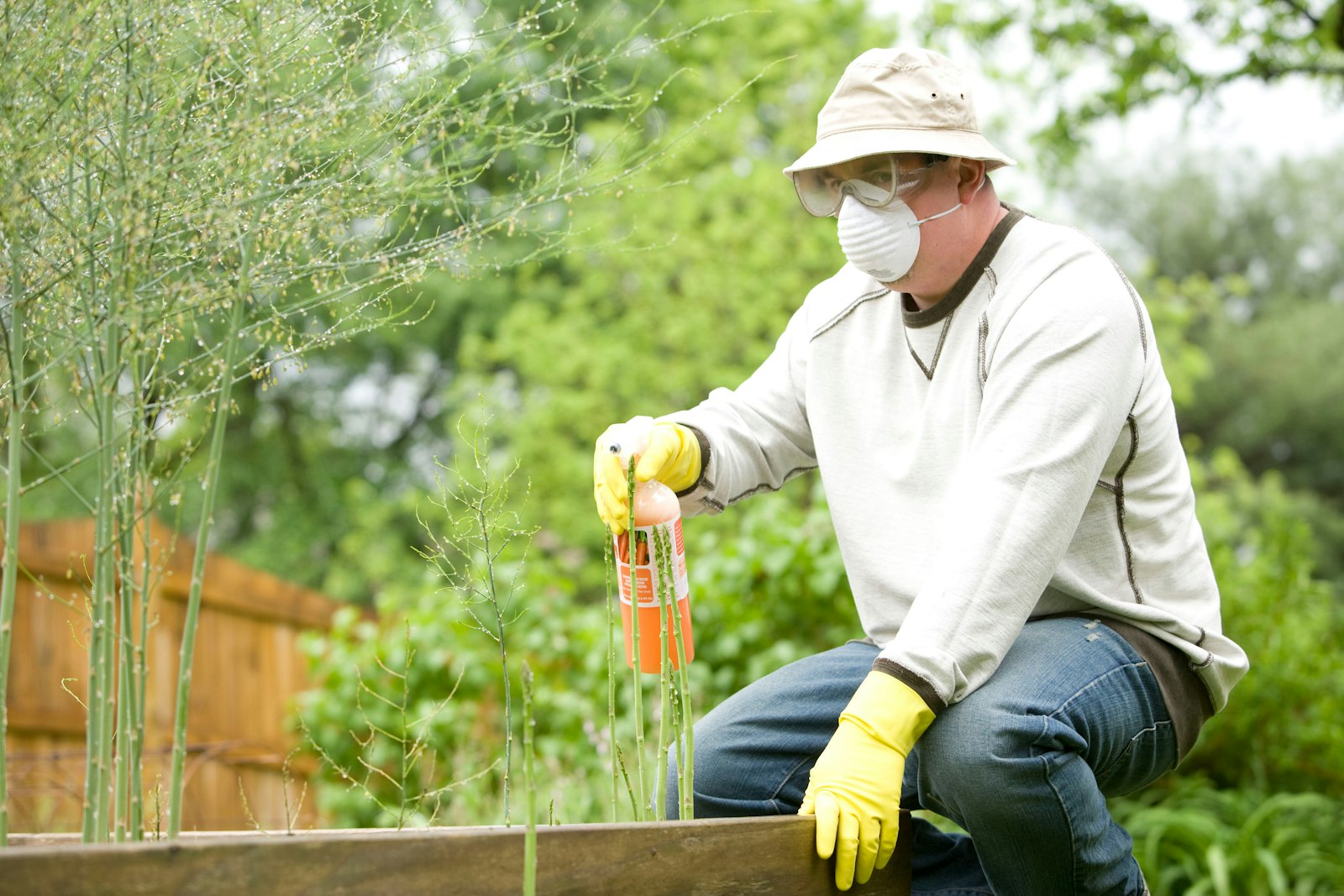 Technician treating the perimeter of a home